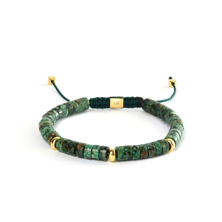 Alexander Lynggaard Bracelet Amazon Heishi Braided 6mm with green stones and gold details on a white background. Model B00212-1
