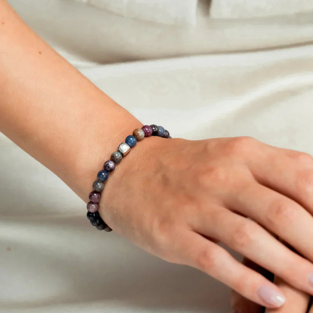 Alexander Lynggaard Bracelet Amalfi 6mm is shown on a wrist with multicolored pearls. Model c10580-001-1