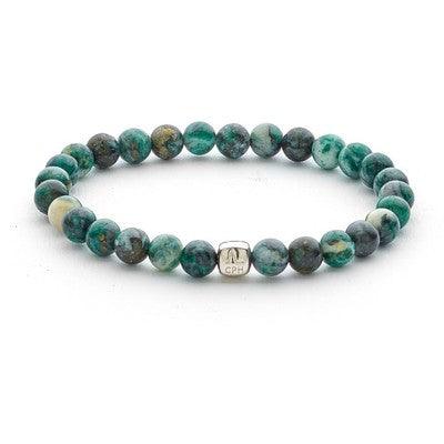 Alexander Lynggaard Bracelet Dioptase 6mm with green pearls and silver detail on a white background. Model C01030-001-1.