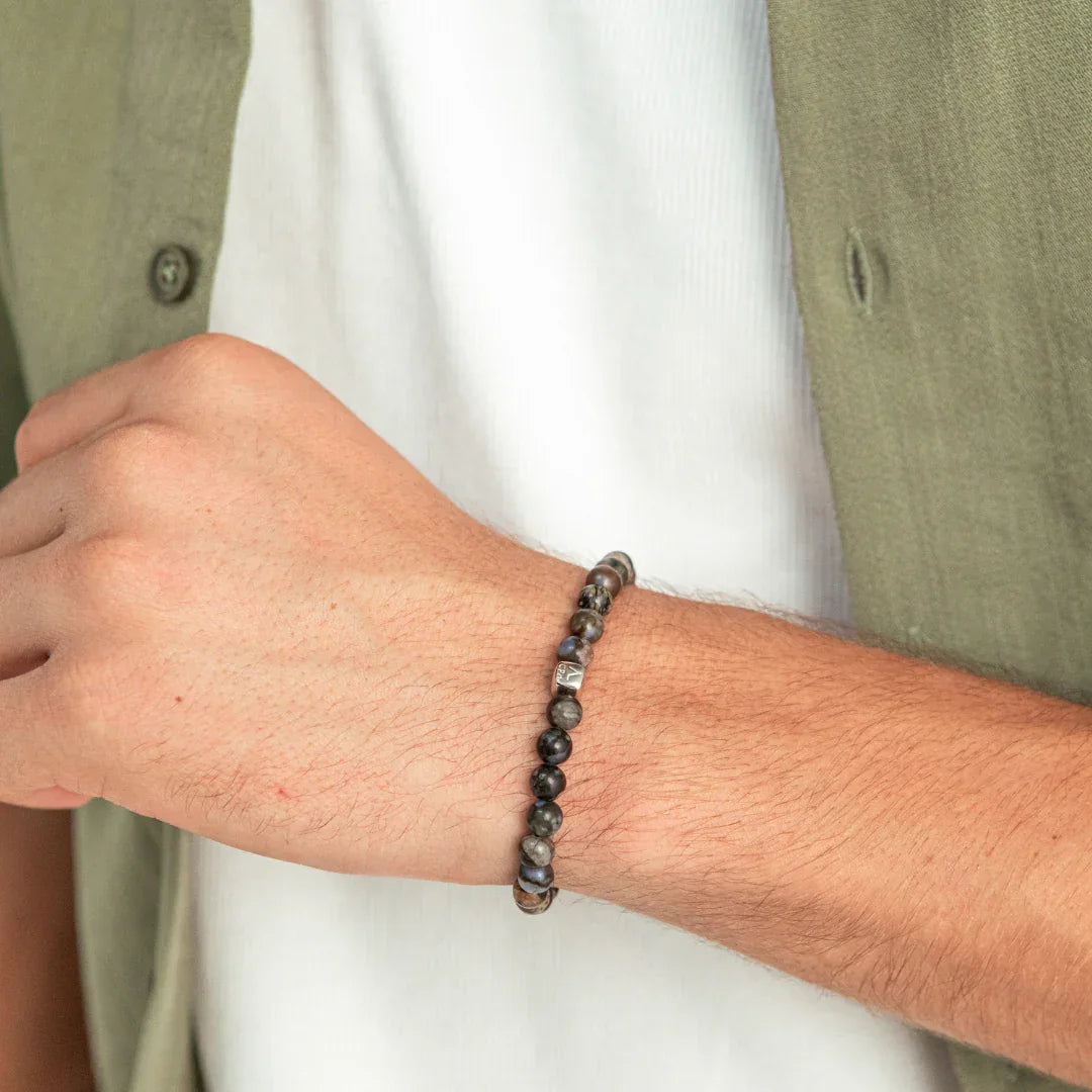 Alexander Lynggaard Bracelet Glaucophane 6mm shown on wrist, dark gray beads. Model c01170-001-1