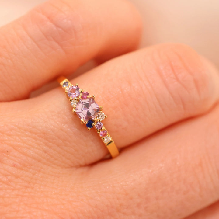 anpé atelier varnaya kuda ring 18kt gold custom made appears on finger with purple and pink stones, Model 27-custom1-001-2