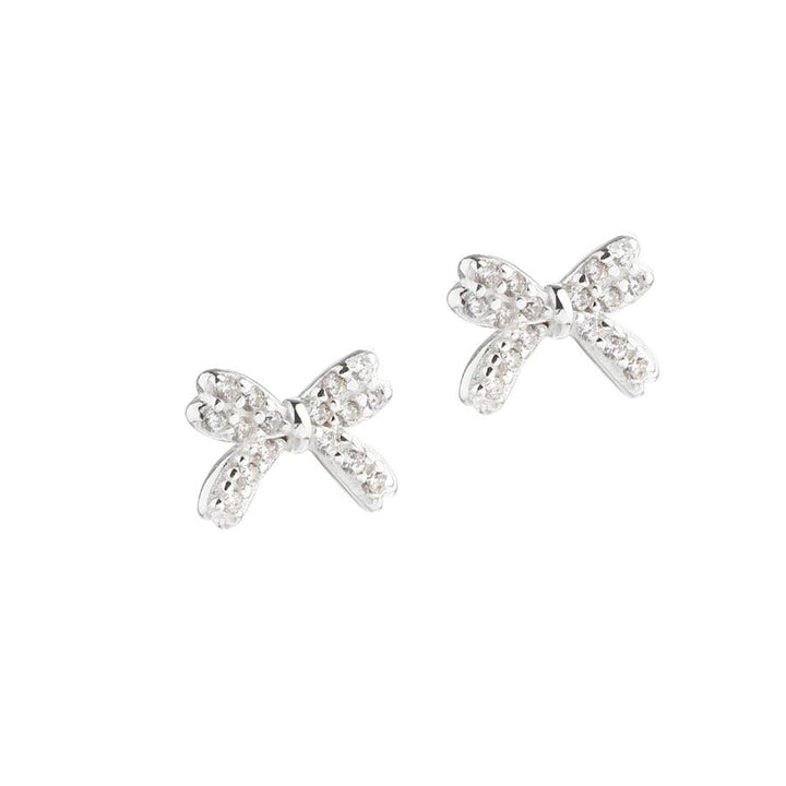 Aqua Dulce Darling Bow earrings silver, fine bow-shaped studs with sparkling stones. Model 5697-1.