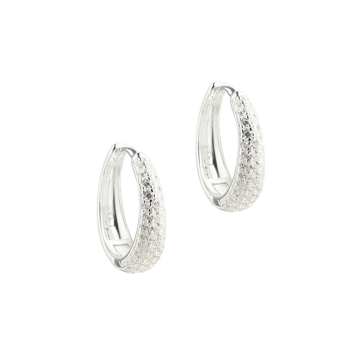 Aqua Dulce Darling Emma Medium Hoop Silver shows a pair of medium earrings in shiny silver with a textured surface. Model 5862-5862-1.