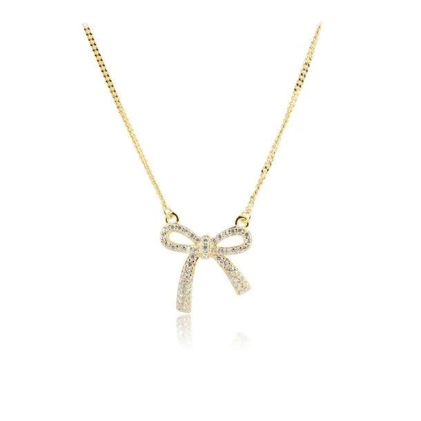 Aqua Dulce Elegant Bow Necklace Gold plated with bow pendant in gold look and sparkling stones, Model 5817-1.