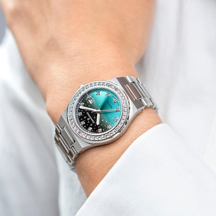 Candino Steel Women's Watch with Stones shows a silver colored wristwatch with a green dial and stone details. Model C47492