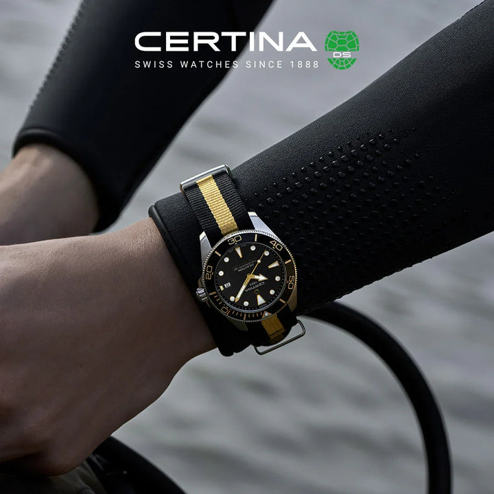 Certina DS Action Diver 40mm Powermatic 80 on black-yellow NATO strap seen on wrist, Model C0484071805101