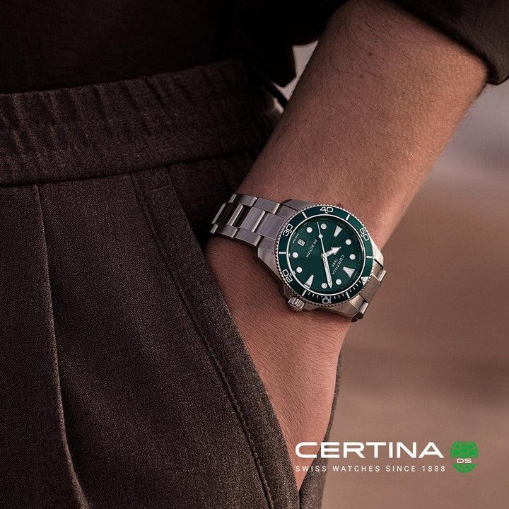 Certina DS Action green dial quartz C0484101109100 worn on wrist, silver colored steel link. Model C0484101109100