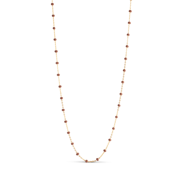 Enamel Lola Necklace Copper shows an elegant, thin gold chain with small copper colored pearls. Model copper-n55g-copper-n55g-copper-1