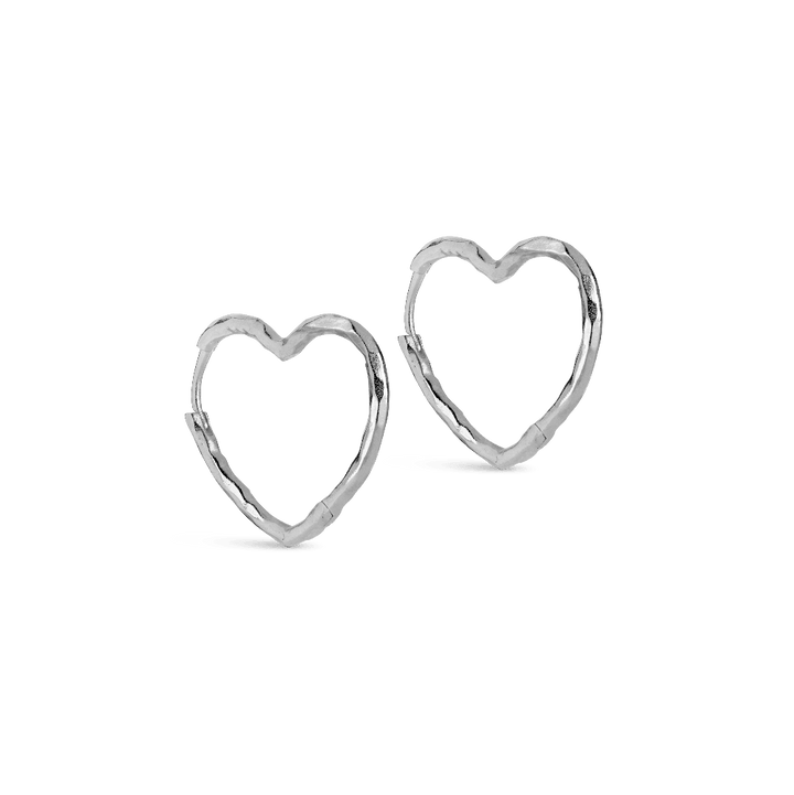 Enamel Organic Heart Medium Hoops shows a pair of silver earrings in an open heart shape. Model e414sm-1