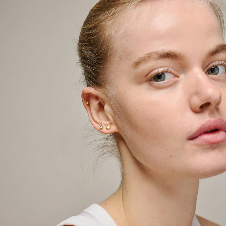 enamel small sunshine earrings daisy e420g daisy shown worn on ear by model, gold tone design, Model e420g daisy-2
