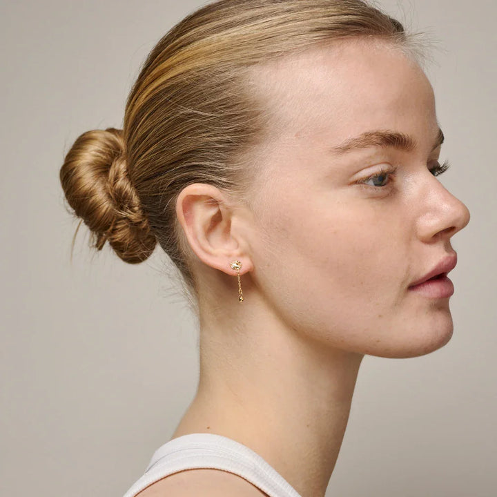 enamel sunshine drop earrings in gold-plated worn by woman with updo hair, elegant sun motif, Model E423G-2