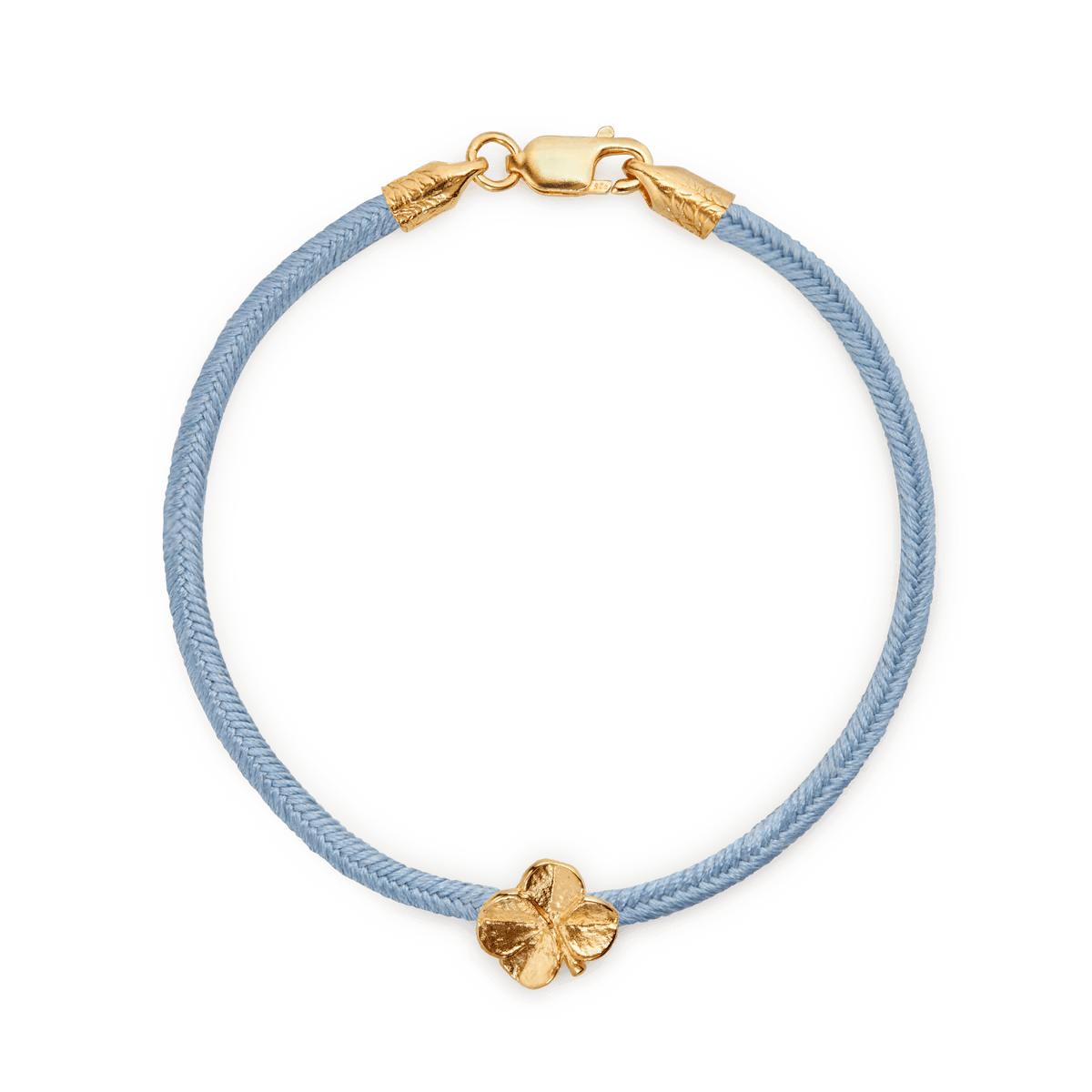 Flora Danica Four Leaf Clover Silk Bracelet Blue Gold Plated shown close up with blue silk cord and four leaf clover charm in gold. Model907-flc-silk-blue-g-001-1.