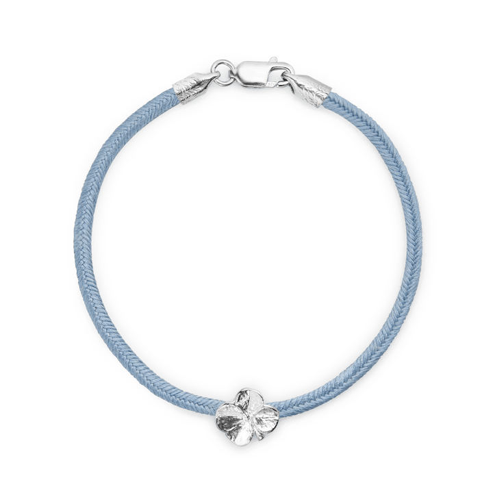 Flora Danica Four-leaf clover silk bracelet with blue silk cord and silver four-leaf clover detail, Model 907-FLC-SILK-BLUE-S-001-1.
