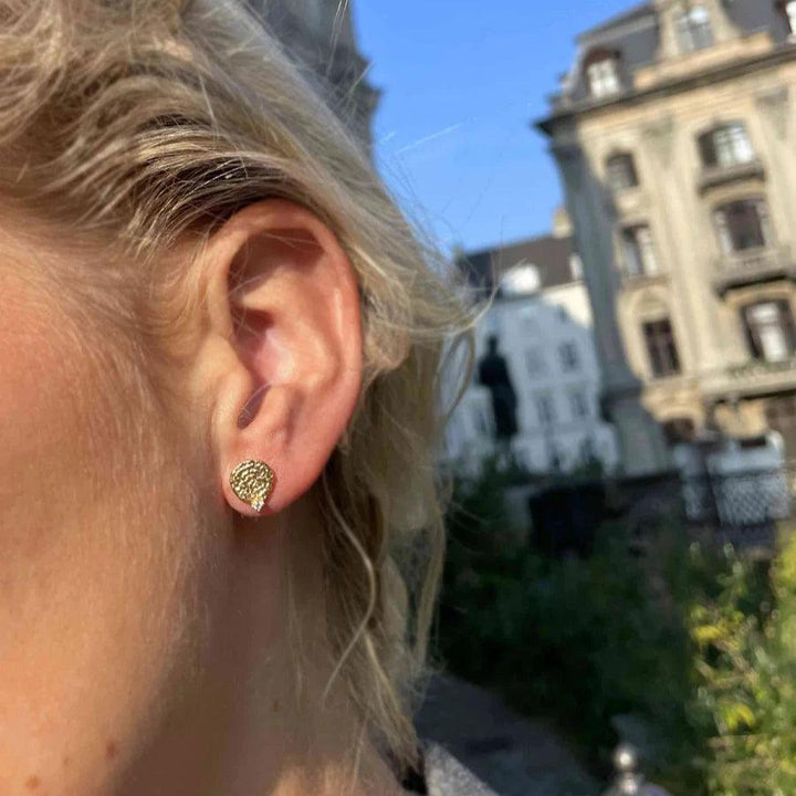 Hultquist Copenhagen Josephine Mini Studs shown on ear in sunlight, gold structure, Model S08563G-2.