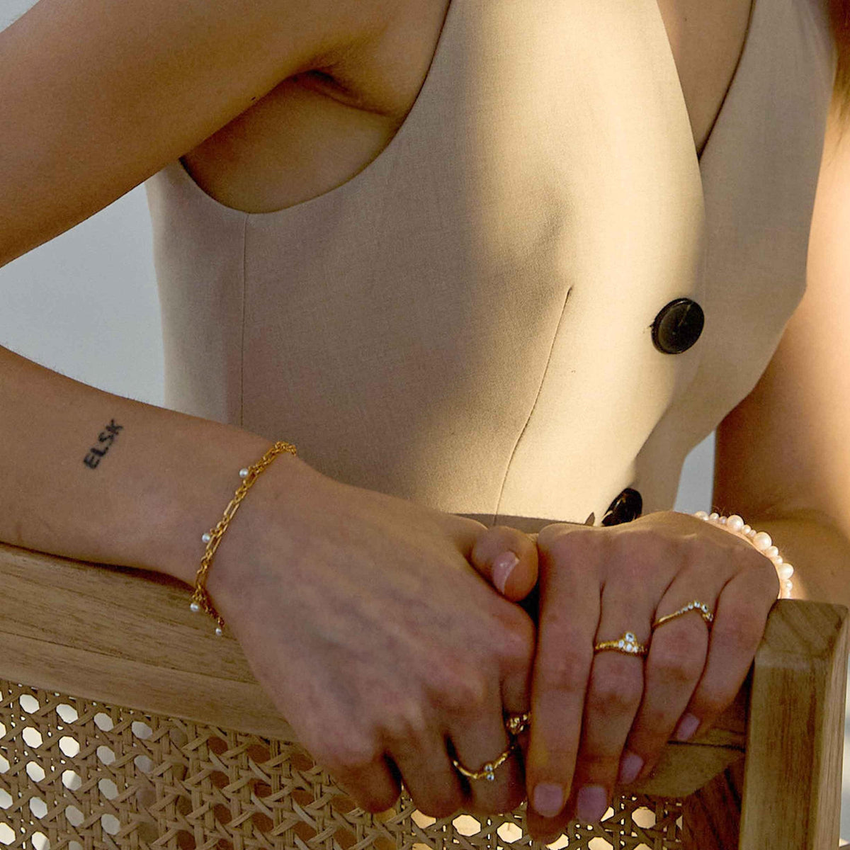 Hultquist Copenhagen Lainey gold plated bracelet worn on wrist, pearl details visible. Model S08591G-1