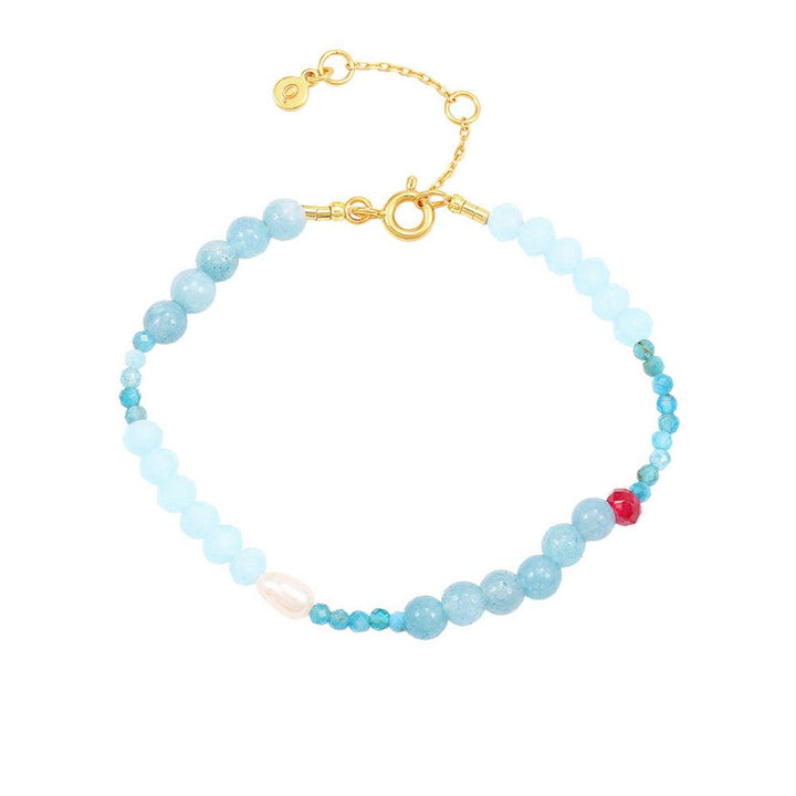 Hultquist Copenhagen Lia Pearl Bracelet with small blue pearls, golden clasp and adjustable chain. Model S08584G-1.