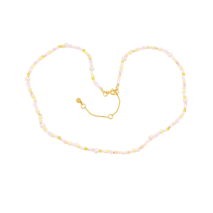 Hultquist Copenhagen Liv Perle Necklace with pastel-colored pearls and gold-colored details on a white background. Model S08624G-1