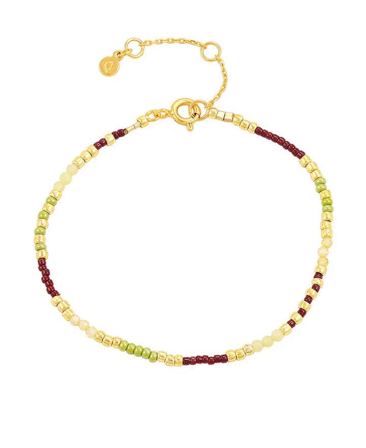 Hultquist Lucky Bracelet with green, yellow and burgundy pearls and gold-coloured details. Model S08638G-1.