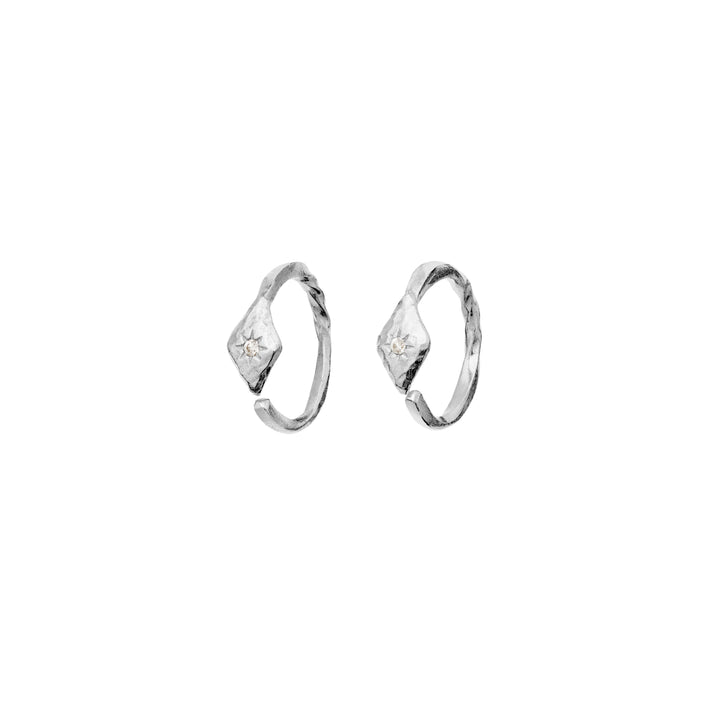 Maanesten Forte silver creoles with beaten surface and small star-shaped detail, Model 10021c-1.
