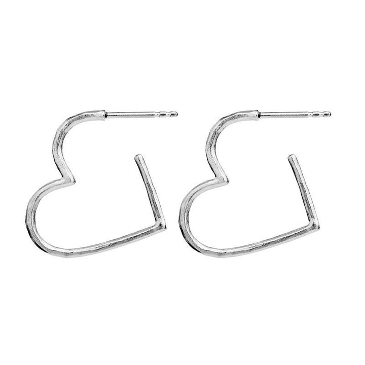 Maanesten Laia Midi Silver Heart Earrings shows a pair of open heart shaped silver earrings against a white background. Model 9962c-1