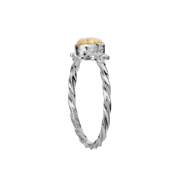 The Moonstone Ula Ring Silver shows an elegant twisted silver ring with a golden stone, Model 4821c-001.