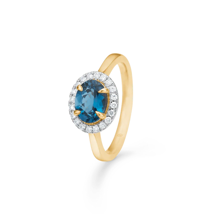 Mads Z 14kt Midnight Blue Diamond Ring with oval blue topaz and diamonds in a gold setting. Model 1546118-001-1.