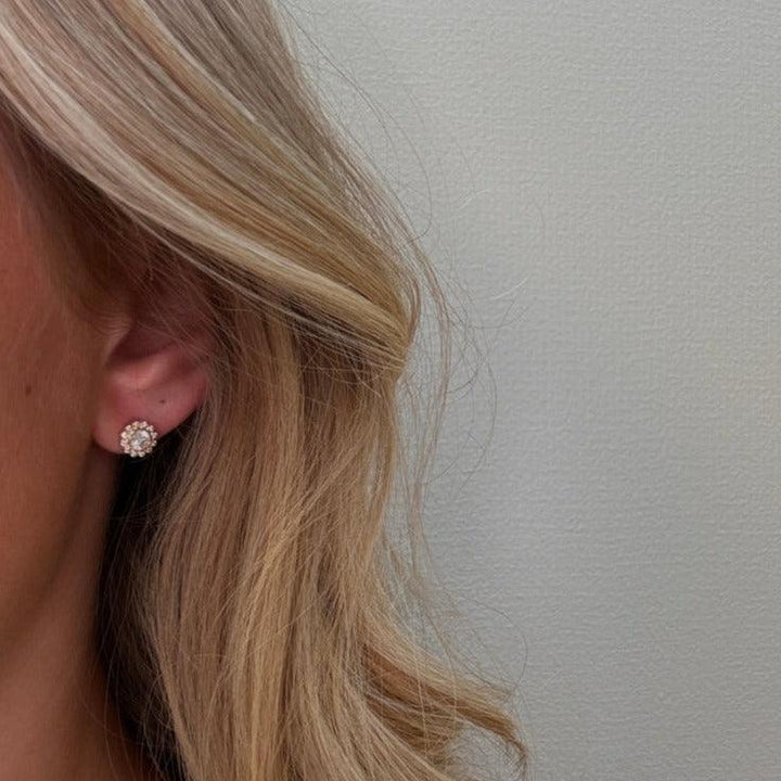 Mads Z 8kt Carmen ear stud with zirconia shown on ear, gold and clear stones Model 3317046-2
