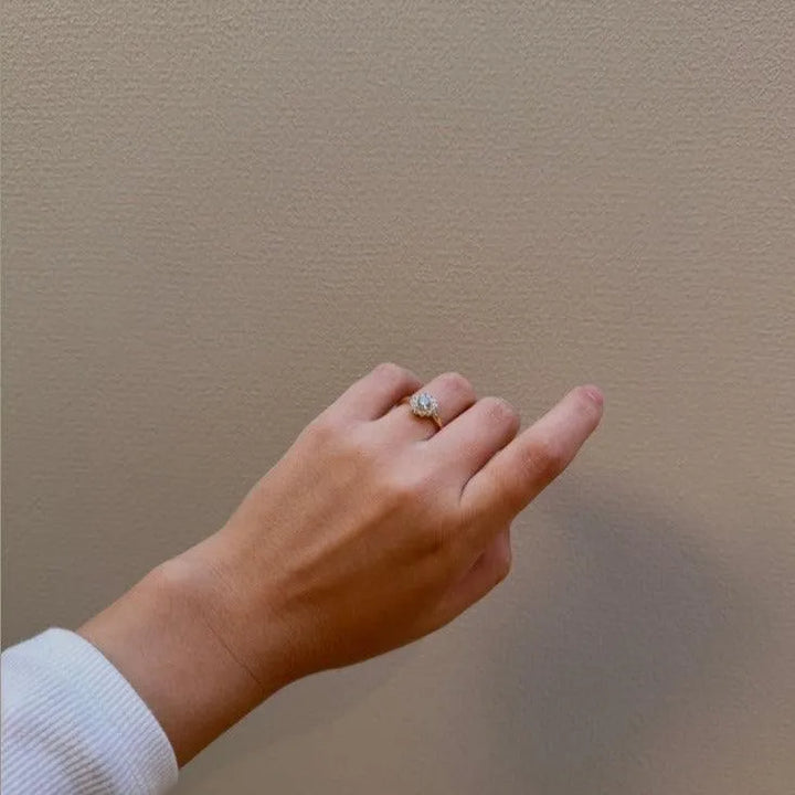 Mads Z 8kt Carmen Ring Zirconia shows a hand with an elegant gold ring and clear zirconia, Model 3347045-001.