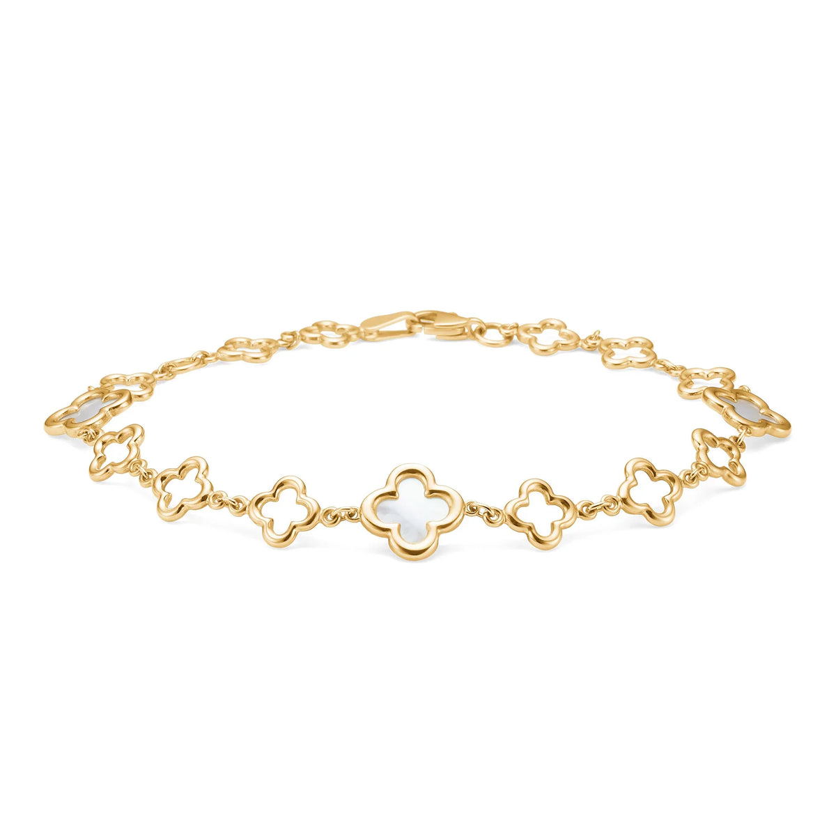Mads Z Aurelia bracelet in 8kt gold with white flower details, lying on a white background. Model 3356043-1