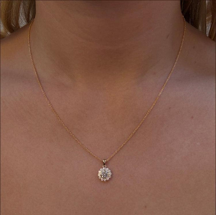 Mads Z Carmen 8kt gold pendant with zirconia is shown worn around the neck, sunny yellow color and classic design. Model 3337046