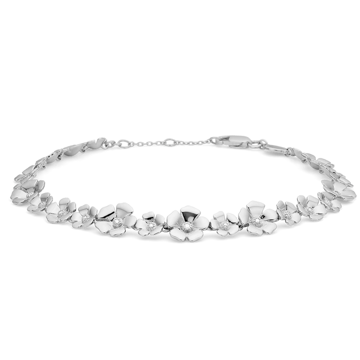 Mads Z Fleur silver bracelet with white topaz shows an elegant bracelet with flowers in silver and white stones. Model 2156108-1.