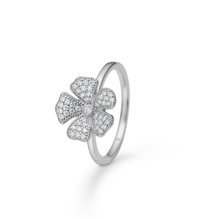 Mads Z Fleur silver ring with pave-set zirconia shows a shiny silver ring with floral motif and clear stones. Model 2147007-001.