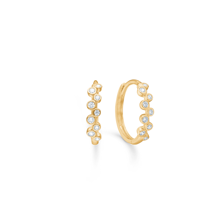 Mads Z Lucy ring in 8 carat gold with 9 zirconia, elegant design with round clear stones. Model 3317035-1