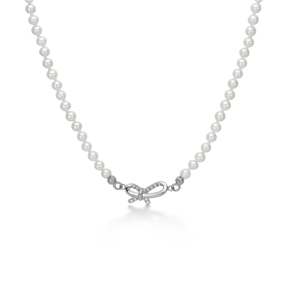 Mads Z Miss Butterfly silver pearl necklace with bow pendant, white pearls and clear bow design. Model 2123030