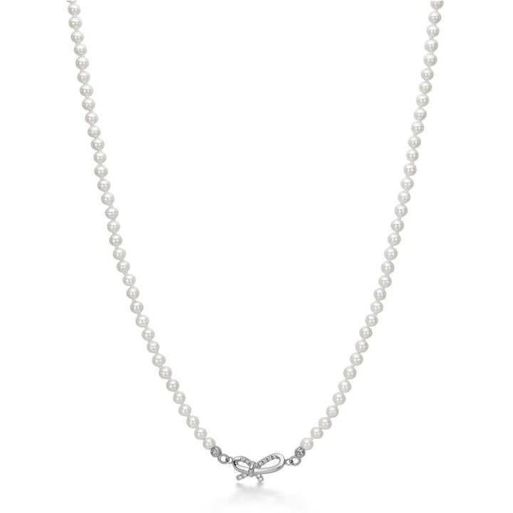 Mads Z Miss Butterfly silver pearl necklace with bow pendant, white pearls on white background. Model 2123030.