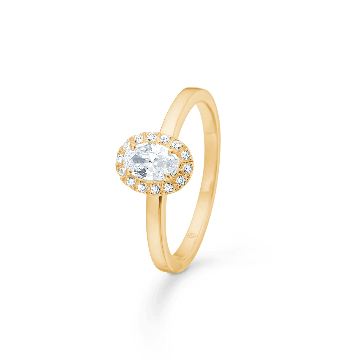 Mads Z Stellar 8kt gold ring with zirconia, oval top and clear stones on a slim gold band. Model 3347001-001.