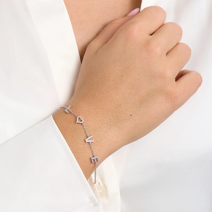 Mads Z Tender Love bracelet in silver with zirconia, LOVE letters on woman's hand, Model 2157100