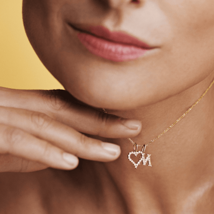 Mads Z Tender Love Letters 14kt gold pendant with diamonds on necklace, seen on model. Model 1531100-001
