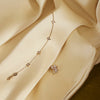 Mads Z Vesper 14kt gold bracelet with stars and diamonds on a silk background. Model 1551197-3