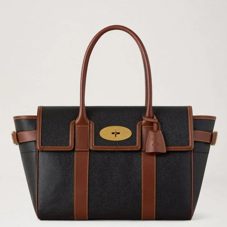 Mulberry Bayswater Black and Cognac Bio-based Scotchgrain shows a spacious black bag with brown details. Model HH0014127A340