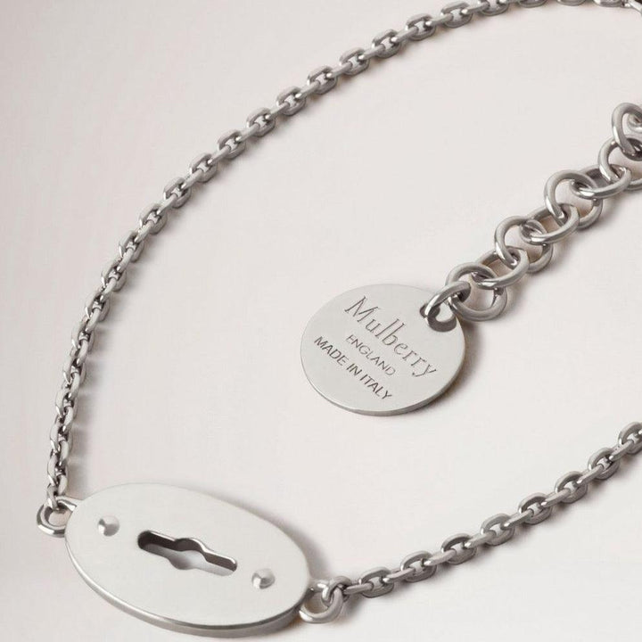 Mulberry Bayswater Bracelet Sterling Silver shows a silver bracelet with a round disc, Model QB2397000D130