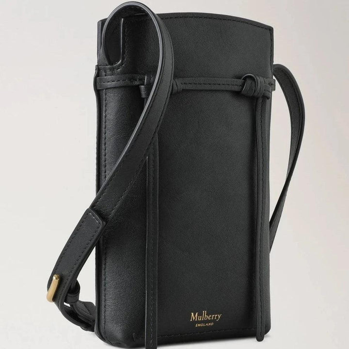 Mulberry Clovelly Phone Pouch Refined Flat Calf Black showcases an elegant black smooth leather phone pouch with adjustable strap. Model RL8072635A100.
