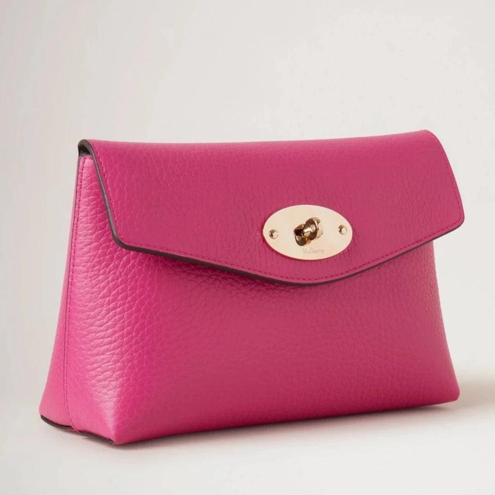 Mulberry Darley Cosmetic Pouch Heavy Grain Mulberry Pink shows a pink clutch in leather with a gold-colored closure. Model RL6544736J191.