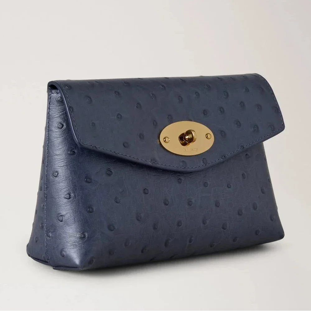 Mulberry Darley Cosmetic Pouch Ostrich Stormy Blue shows a blue cosmetic pouch in embossed leather with a gold-colored buckle. Model RL8933738U918.