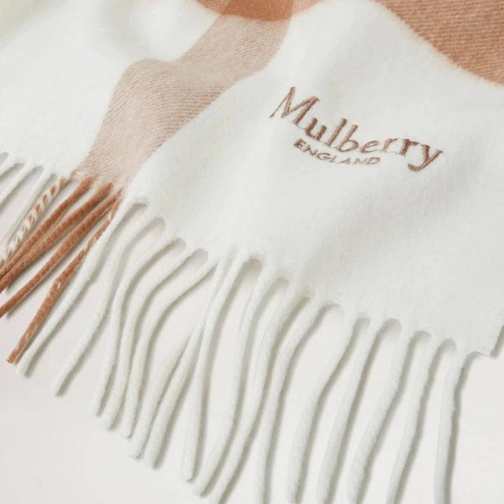 Mulberry Large Check Merino Wool Scarf features light beige and white checked wool, fringe and embroidered logo. Model VS4295889E640.