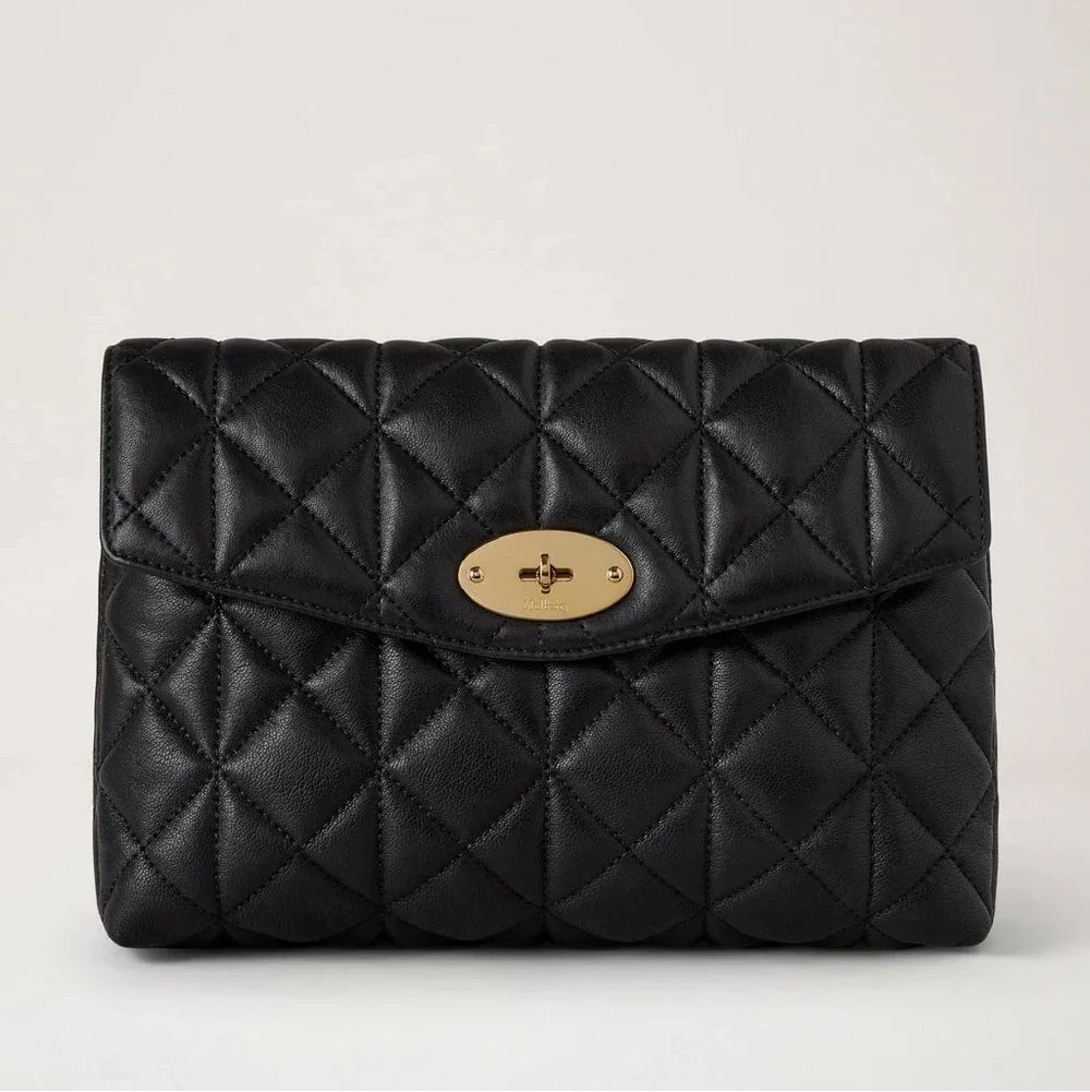 Mulberry Large Darley Cosmetic Pouch shows a black quilted cosmetic pouch in leather with gold details. Model RL8897676A100