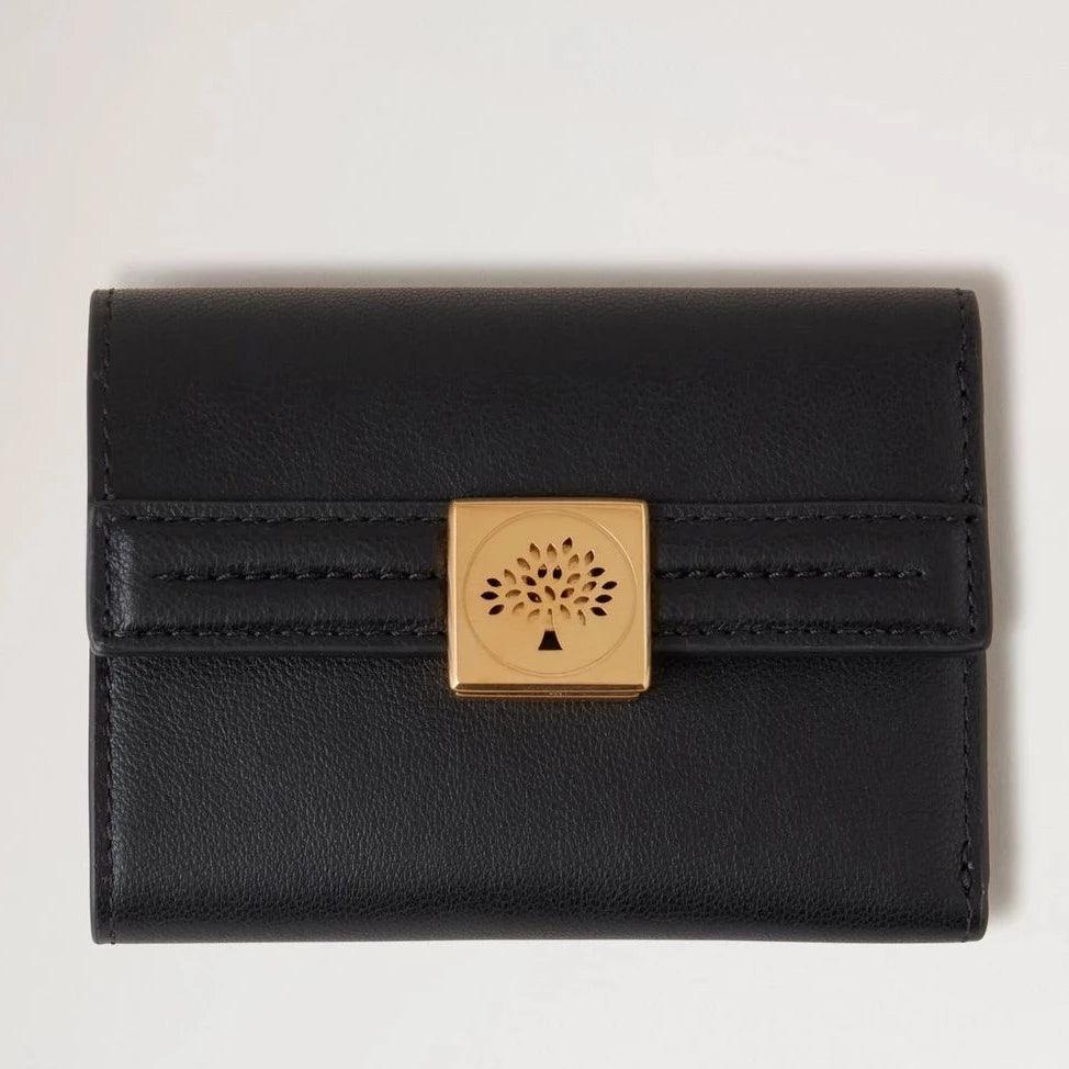 Mulberry Mulberry Tree Trifold Black designs a black leather trifold wallet with gold-colored clasp, Model RL7894587A100.