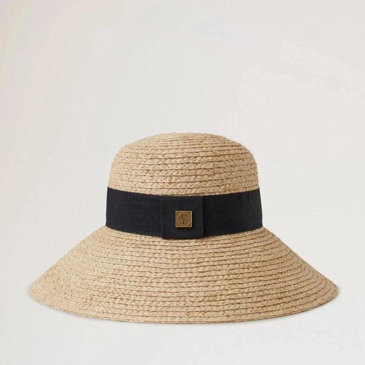 Mulberry Raffia Sun Hat Wide Brim shows a natural colored straw hat with a wide black band. Model VH4136060H120-001-1