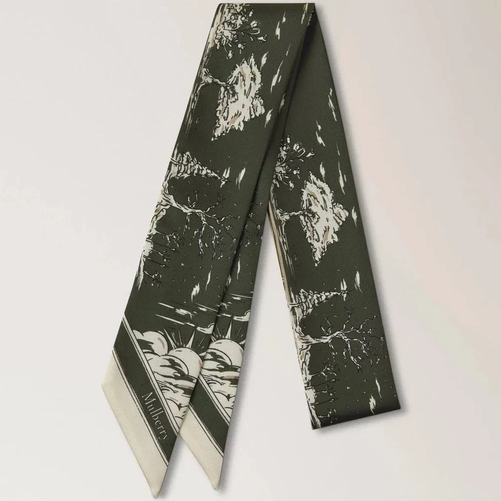 Mulberry Skinny Scarf British Park Juniper Green shows thin scarf in green silk with park motif, Model VS4867145Q749.