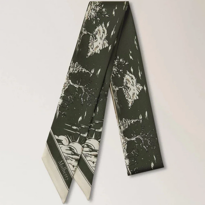 Mulberry Skinny Scarf British Park Juniper Green shows thin scarf in green silk with park motif, Model VS4867145Q749.